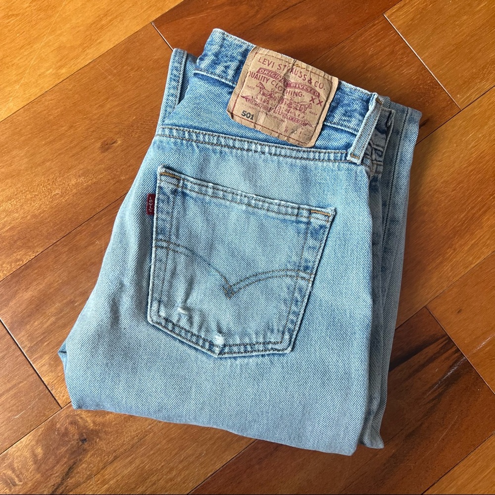 Levi’s 501 light wash blue distressed 90s straight leg jeans